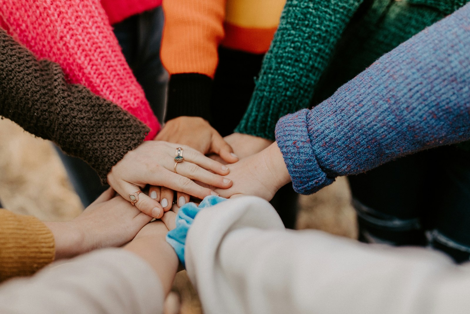 Hands coming together to represent a connected community