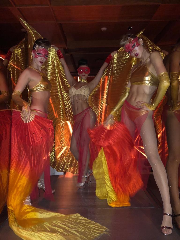 Tools for Talent performers in red and gold costumes