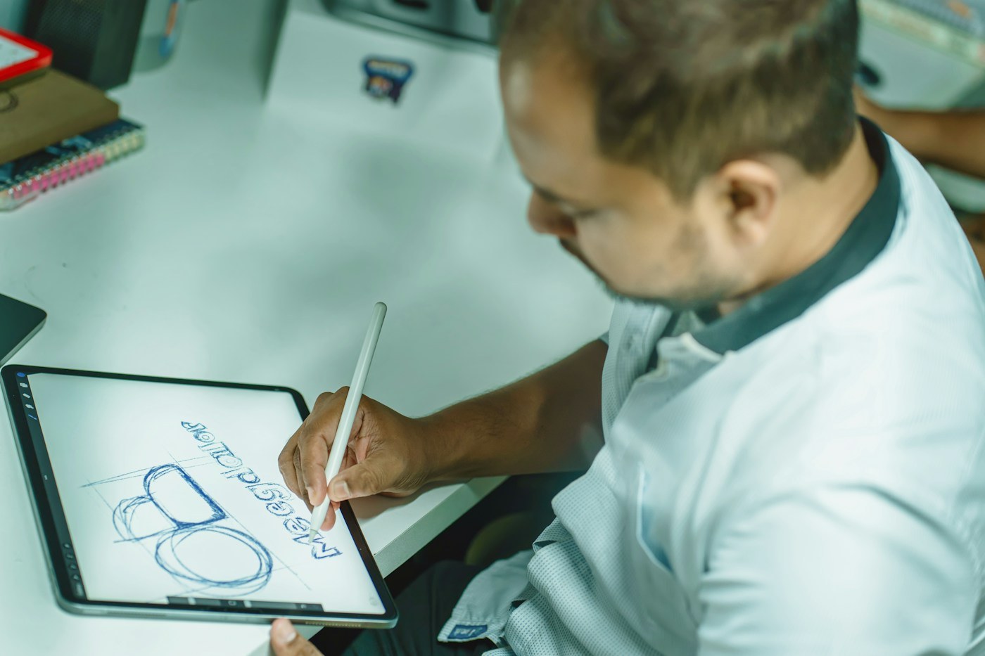 Illustrative designer developing a visual concept on a digital tablet
