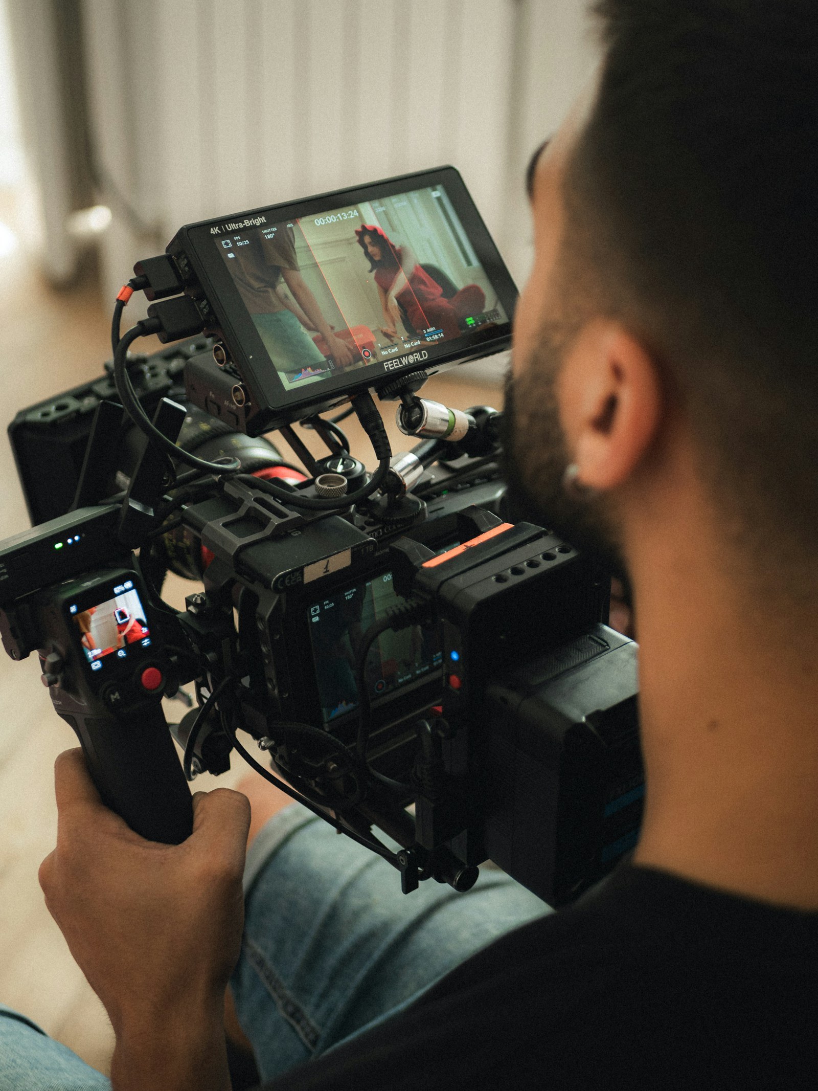 A filmmaker operating a professional video camera rig